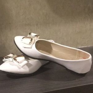 White pleather flats